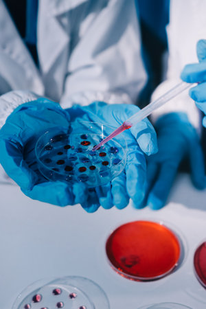 Researcher using a professional microscopeの写真素材