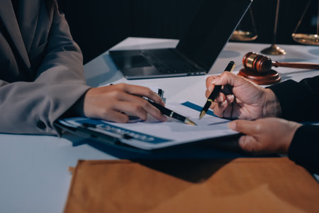 Concept of legal counseling. The lawyer or legal counsel is listening and providing advice to business people.の写真素材