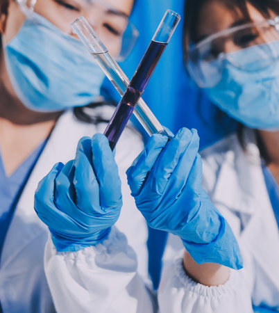 Researcher using a professional microscopeの写真素材