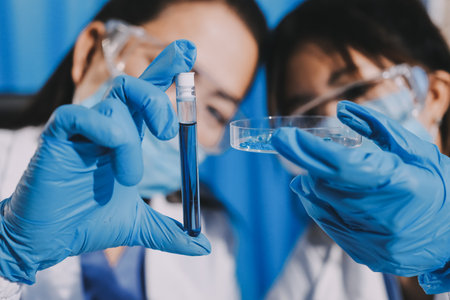 Researcher using a professional microscopeの写真素材