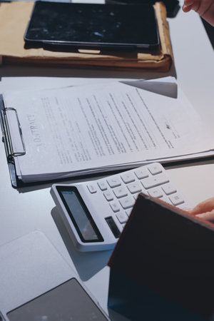 Female Real Estate Broker presenting and advised to 
model home and building project detail in the office, sign purchase sales contract, agreements concerned mortgage loan offer and insurance.の写真素材