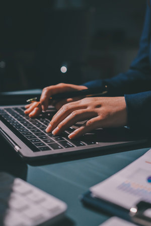 Expert woman asian female people review data number costing managerial account prepare monthly actual cost variance report at tax audit office. ESG sheet budget control ERP process service project.の写真素材