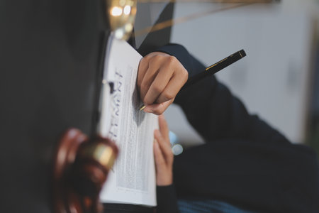 female business woman lawyers working at the law firms. Judge gavel with scales of justice. Legal law, lawyer, documents, advice and justice concept.の写真素材