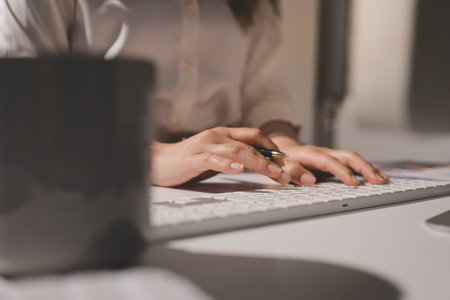 Expert woman asian female people review data number costing managerial account prepare monthly actual cost variance report at tax audit office. ESG sheet budget control ERP process service project.の写真素材