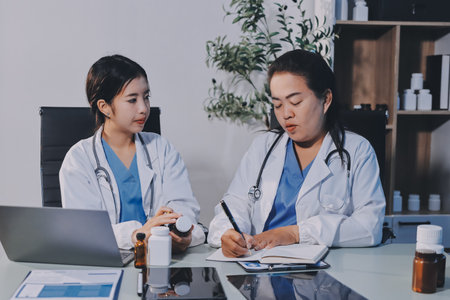 Two doctors are having a meeting in a hospital room.の写真素材