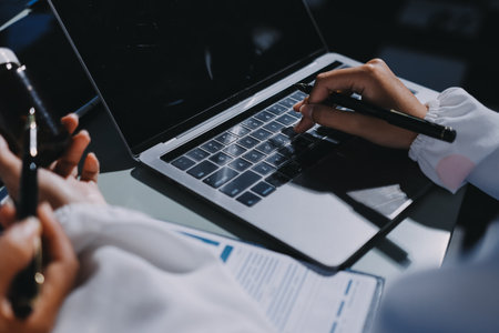 Male and female doctors are having a meeting in a hospital room.の写真素材