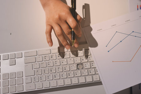 Expert woman asian female people review data number costing managerial account prepare monthly actual cost variance report at tax audit office. ESG sheet budget control ERP process service project.の写真素材