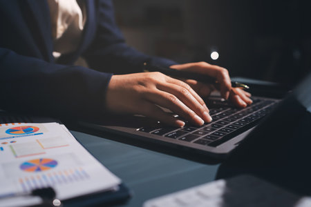 Expert woman asian female people review data number costing managerial account prepare monthly actual cost variance report at tax audit office. ESG sheet budget control ERP process service project.の写真素材
