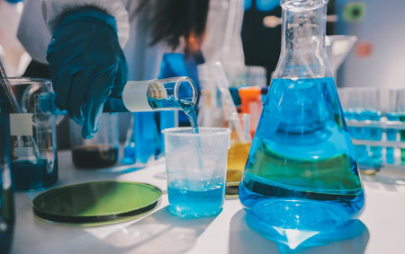 Scientist pipetting medical samples into microplate in laboratoryの写真素材