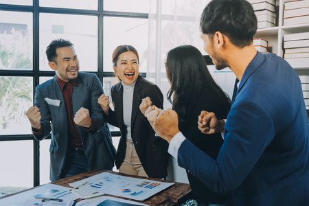 Business handshake for teamwork of business merger and acquisition,successful negotiate,hand shake,two businessman shake hand with partner to celebration partnership and business deal conceptの写真素材