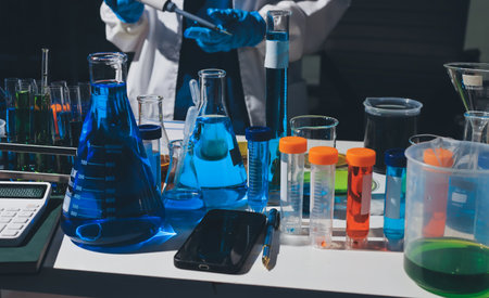 Scientist pipetting medical samples into microplate in laboratoryの写真素材
