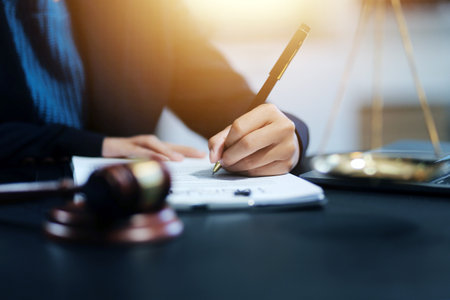 female business woman lawyers working at the law firms. Judge gavel with scales of justice. Legal law, lawyer, documents, advice and justice concept.の写真素材