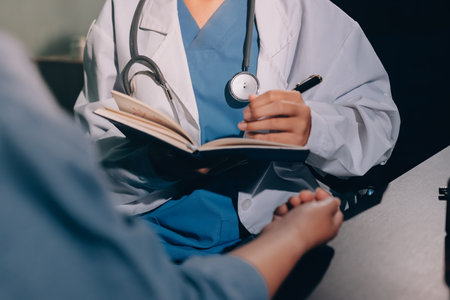 Doctor, patient and hands on wrist with pulse for blood pressure, wellness or consulting in hospital. Female medical professional, black woman or helping hand for healthcare, advice or test in clinicの写真素材