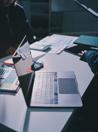 Group of business women working on a financial data expenses document.