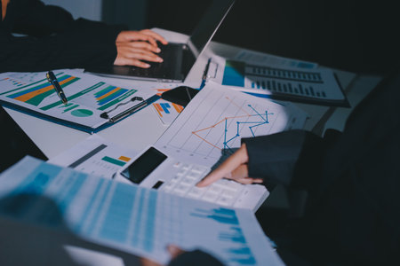 Group of business women working on a financial data expenses document.の写真素材
