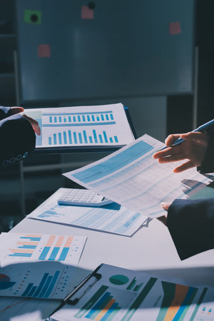 Group of business women working on a financial data expenses document.の写真素材