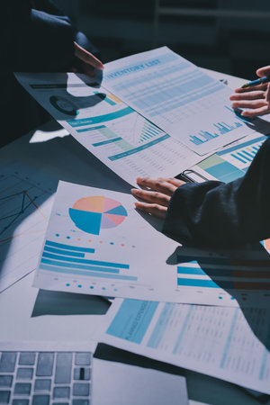 Group of business women working on a financial data expenses document.の写真素材