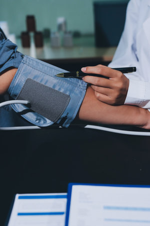Close-up of doctor checking blood pressure