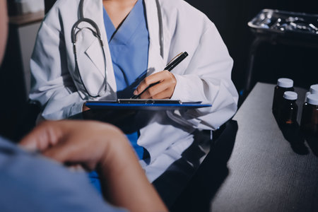 Doctor, patient and hands on wrist with pulse for blood pressure, wellness or consulting in hospital. Female medical professional, black woman or helping hand for healthcare, advice or test in clinicの写真素材