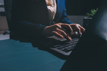 Expert woman asian female people review data number costing managerial account prepare monthly actual cost variance report at tax audit office. ESG sheet budget control ERP process service project.の写真素材