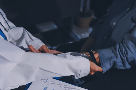 Doctor, patient and hands on wrist with pulse for blood pressure, wellness or consulting in...