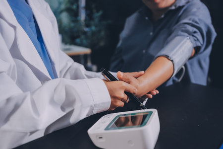 Close-up of doctor checking blood pressure