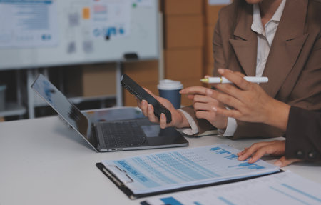 Accounting company provide finance and taxation planning for profitable cash flow, Auditor and accountant team working in office, analyze financial data and accounting record with calculator.Insightの写真素材