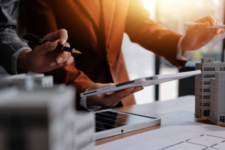 Discussion among businesspeople on the latest developments in solar cell panel technology and Solar Energy Environment city Concept.の写真素材