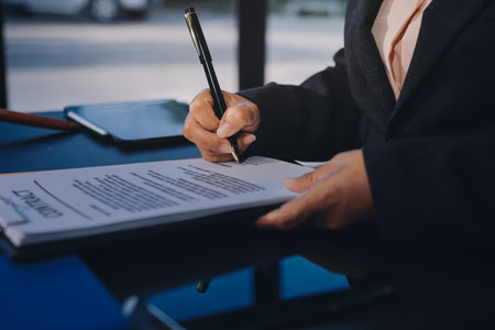 Business woman in suit or lawyer working on a documents. Legal law, advice and justice concept.の写真素材