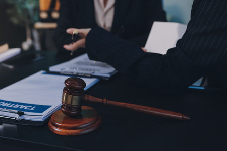 Judge gavel with Justice lawyers, Business woam in suit or lawyer working on a documents. Legal law, advice and justice concept.の写真素材