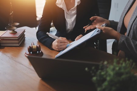 Lawyers having team meeting at law firm background. Concepts of Law and Legal services.の写真素材