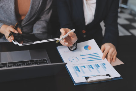 Accounting company provide finance and taxation planning for profitable cash flow, Auditor and accountant team working in office, analyze financial data and accounting record with calculator.Insightの写真素材