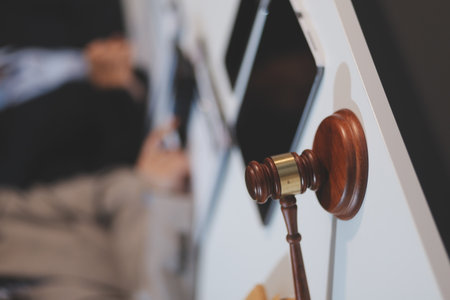 Judge gavel with lawyers having team meeting at law firm background. Concepts of Law and Legal...