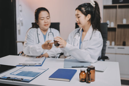 doctors and nurse having informal meeting in hospital canteenの写真素材