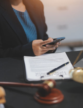 female business woman lawyers working at the law firms. Judge gavel with scales of justice. Legal law, lawyer, documents, advice and justice concept.の写真素材