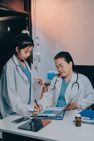 doctors and nurse having informal meeting in hospital canteenの写真素材