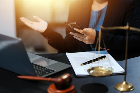 female business woman lawyers working at the law firms. Judge gavel with scales of justice. Legal...