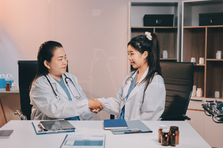 doctors having informal meeting in hospital canteenの写真素材