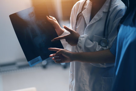 Medical Team Using Digital Tablet for Healthcare, Doctor Technology, X-Ray Analysis.の写真素材