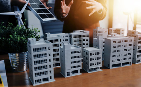 Discussion among businesspeople on the latest developments in solar cell panel technology and Solar Energy Environment city Concept.の写真素材