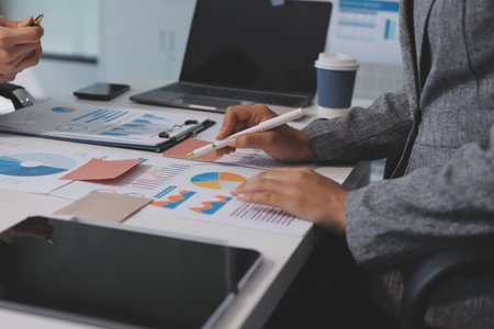 Accounting company provide finance and taxation planning for profitable cash flow, Auditor and accountant team working in office, analyze financial data and accounting record with calculator.Insightの写真素材
