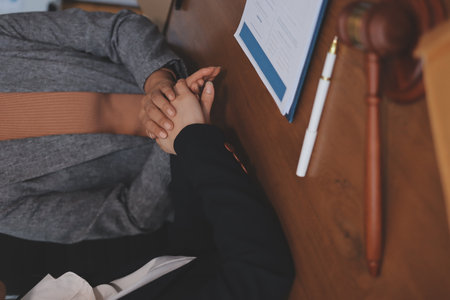 Judge gavel with Justice lawyers having team meeting at law firm background. Concepts of Law and Legal services.の写真素材