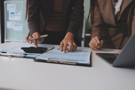 Accounting company provide finance and taxation planning for profitable cash flow, Auditor and accountant team working in office, analyze financial data and accounting record with calculator.Insightの写真素材