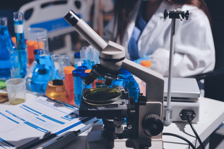 Scientist pipetting medical samples into microplate in laboratoryの写真素材