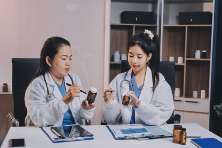 doctors having informal meeting in hospital canteenの写真素材