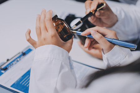 doctors and nurse having informal meeting in hospital canteenの写真素材