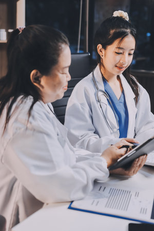 doctors having informal meeting in hospital canteenの写真素材