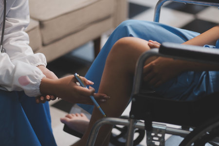 A female doctor examines an elderly patient with knee pain due to arthritis. The patient is being...