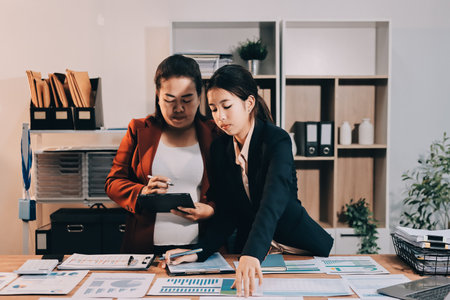 Business meeting time. Business man and business woman working on startup project.の写真素材