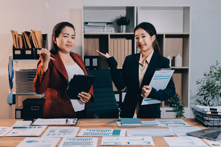 Business meeting time. Business man and business woman working on startup project.の写真素材
